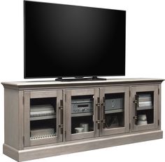 a flat screen tv sitting on top of a wooden entertainment center