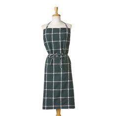 a green and white checkered apron on a mannequin