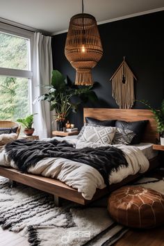 a bedroom with black walls, white and brown bedding and plants in the corner