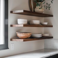 some shelves with bowls and plates on them