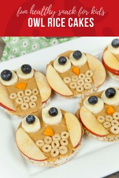 some food is on a white plate with blueberries and apples in the shape of an owl