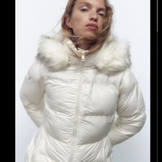 Fitted Jacket With High Collar And Hood With Removable Faux Fur Trim. Long Sleeves With Elasticized Cuffs. Front Pockets With Interior Lining And Zip Closure. Front Zip Closure. (New) Color: Ecru Runs Small White Down Outerwear With Double-lined Hood, White Hooded Down Parka, White Down Outerwear With Detachable Hood, White Winter Outerwear With Detachable Hood, White Puffer Parka For Fall, White Down Outerwear With Padded Collar, Winter White Puffer Jacket With Detachable Hood, White Nylon Hooded Jacket For Fall, Winter White Down Outerwear For Winter