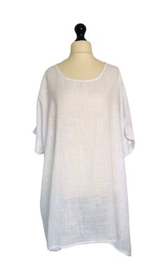 Add a touch of Italian style to your wardrobe with this oversized cotton tunic from Italy Moda. The versatile white tunic blouse is perfect for any occasion and can be dressed up or down. Its short sleeves and airy design make it ideal for warmer weather, while the plus size fit is flattering and comfortable for UK sizes 16 18 20 22 24 Machine washable for easy care, this tunic is a must-have addition to your wardrobe. The unique Lagenlook style and on-trend features, such as the oversized fit a White Tunic Blouse, Italy Moda, Lagenlook Style, Uk Size 16, Cotton Tunic, Oversized Tunic, White Tunic, Plus Size Fits, Tunic Blouse