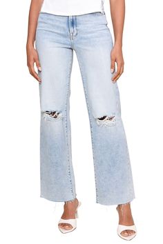 Experience elevated style with the Med Wash Distressed High Rise jeans. Featuring a high waistline, medium wash denim, and scissor cut hems, these jeans are perfect for a night out when paired with your favorite bodysuit and heels. The distressing throughout adds a touch of edginess to your look. Model is 5'10" and wearing a size 25 93% Cotton, 5% Polyester, 2% Spandex Machine wash cold Hang or line dry Trendy Medium Wash Rigid Denim Flare Jeans, Trendy High Rise Medium Wash Cropped Jeans, Medium Wash Ripped Cutoff Flare Jeans, Trendy Medium Wash Cutoff Flare Jeans, Distressed Cutoff Flare Jeans, Ripped Cutoff Medium Wash Flare Jeans, Distressed Denim Cutoff Flare Jeans, Distressed Denim Flare Jeans With Cutoff, Chic High Rise Denim Flare Jeans