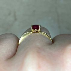 This stunning vintage ring features a 1.00 carat oval-cut ruby center. The center ruby is prong-set in 14k yellow gold, with round brilliant cut diamonds pave-set along the shoulders. The total approximate diamond weight is 0.11 carats.
The approximate measurements of the center stone are 6.82mm x 4.89mm.
This ring is currently sized at 6.5 and can be resized at no additional cost.
Ready to Make It Yours? Reserve it now or get more info! Classic Yellow Gold Ruby Ring With Oval Cabochon, Oval Cabochon Ruby Ring In Yellow Gold, Red Ruby Oval Cabochon Ring In 14k Gold, Ruby Rings With Center Stone, Oval Cabochon Shape, Classic Red Ruby Ring, Oval Cabochon, Ruby Ring, Oval Cut, Round Brilliant Cut Diamond, Pave Diamonds