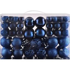 black and blue ornaments in a clear box