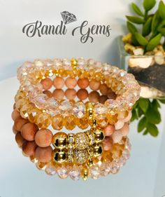 "This bracelet set is elegant and will make you feel like the queen you are. Handmade beautiful stack of 4 bracelets. Beautiful mixture of Blush Pink and Peach stones. Natural Gemstones and Crystal Glass Beads. Stretch bracelet set available in various sizes.  Materials 8mm Pink Aventurine Beads 8mm Clear Light Pink iridescent Beads 8mm Peach iridescent beads Pave CZ Circon Gold Plated Bead Gold Plated Hematite Beads Orders shipped within 1 - 2 business days   Standard Bracelet Sizing Small Wris Adjustable Peach Bracelet, Elegant Orange Bracelets With Faceted Beads, Peach Faceted Round Beads Jewelry, Orange Stackable Jewelry With Round Beads, Orange Stackable Round Bead Jewelry, Peach Beaded Bracelet, Wedding Brainstorming, Peach Bracelet, Pink Aventurine