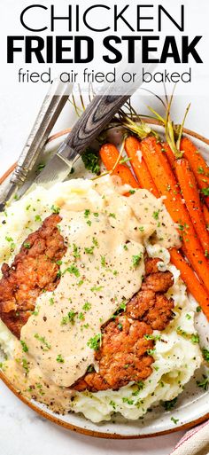 chicken fried steak with creamy gravy served over mashed potatoes and carrots