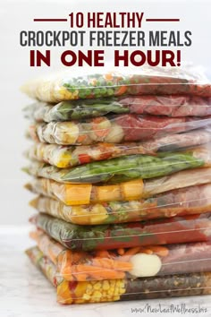 a stack of food wrapped in plastic with text overlay reading 10 healthy crockpot freezer meals in one hour