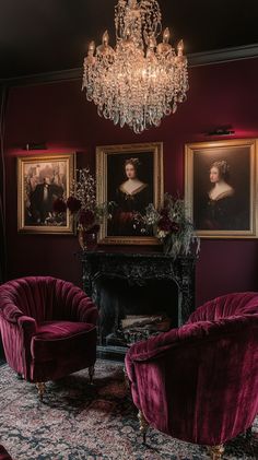 Dark burgundy wall with gold frames, antique paintings, velvet armchairs, and chandeliers create a cozy dark academia living Romanticism Era, Burgundy Walls, Moody Living Room, Gold Frames, Dark Burgundy, Rich Color Palette, Baroque Style, Dark Academia Aesthetic, Velvet Armchair