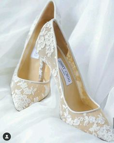 a pair of wedding shoes with lace on them