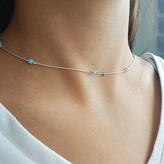 Gold filled, Sterling Silver or Rose Gold necklace with a dainty lab opal beads. Colors - white, dark blue, light blue, green or pink. You can wear everyday, alone or layer with more necklaces. This necklace is perfect for yourself, giving as a special gift, or bridesmaid necklace***CHOKER LENGTH:X SMALL 12-14 INCH + 1.5 INCH EXTENSIONSMALL  13-14 INCH + 1.5 INCH EXTENSIONMEDIUM 14-16 INCH + 1.5 INCH EXTENSIONLARGE 16-17.5 INCH + 1.5 INCH EXTENSION If you would like this chain altered, please co Dainty Adjustable Opal Necklace, Dainty Opal Adjustable Necklace, Minimalist Opal Jewelry With Delicate Chain, Delicate Silver Opal Necklace, Delicate Silver Opal Jewelry, Minimalist Opal Necklaces With Delicate Chain, Silver Opal Necklace In Dainty Style, Minimalist Opal Necklace With Delicate Chain, Silver Opal Dainty Necklace