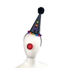 "This classic clown hat is perfect for plays, burlesque acts, vaudeville, you name it- any time you need that perfect retro look. it stands 8\" inches high. It is made with a buckram and wire base and had been covered in two layers of fabric, the top being a black. It has sequins and pom poms on the base, up the front, and a handmade pom pom in black tops it off. It slides on to a black satin headband and you can position it any way you want. I use only the most comfortable headbands around. One Halloween Costume Accessories With Round Crown, Adjustable Halloween Costume Accessories For Theater, Adjustable Halloween Theater Costume Accessories, Adjustable Costume Accessories For Carnival And Halloween, High Crown Hats For Halloween Costume Party, High Crown Top Hat For Carnival, Round Crown Costume Hats For Halloween, Halloween Costume Hats And Headpieces With Round Crown, Halloween Costume Hats With Round Crown