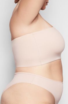 Your favorite loungewear has finally met its match with this bandeau from Kim Kardashian West's SKIMS that stretches across curves with second-skin softness. Available in nine different tones, this quick-drying and smoothing bralette is great for layering under airy clothing pieces or wearing at home. Style Name:Skims Fits Everybody Bandeau Bralette (Regular & Plus Size). Style Number: 6016409. Micro-elastic Sports Bra With Built-in Bra, Solid Color Bandeau Shapewear, Strapless Seamless Shapewear, Compressive Shapewear Bra With Removable Pads, Solid Color Bandeau Sports Bra With Built-in Bra, Micro-elastic Seamless Shapewear Bra, Seamless Micro-elastic Shapewear Bra, Smoothing Bandeau Style Shapewear, Seamless Shapewear Bra