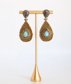 These earrings are a beautiful combination of gold, black, and turquoise. They are sure to add a touch of elegance to any outfit. Black Turquoise, Turquoise Earrings, Tennis Bracelet, Christmas Sale, Gold Black, Rainbow Colors, Turquoise, Drop Earrings, Gemstones