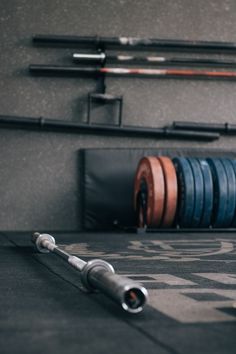 there are many different types of barbells on the floor