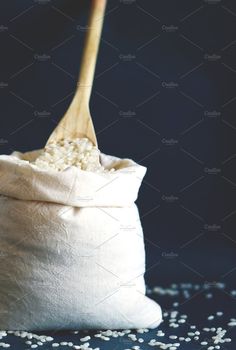 rice in a bag with a wooden spoon