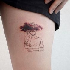 a woman's thigh with a drawing of a girl holding her hand to her face