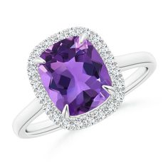 Crafted in cathedral style, this is an elegant cocktail ring in 14k white gold. The claw-set deep purple cushion amethyst is illuminated by a halo of several sparkling diamonds. Classic Purple Diamond Ring With Halo Setting, Purple Cushion Cut Diamond Rings, Purple Diamond Cushion Cut Rings, Cushion Cut Purple Amethyst Ring, Classic Purple Cushion Cut Rings, Purple Cushion, Girls Ring, February Birthstone Jewelry, Amethyst Cathedral