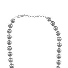 Add the shine of silver to any look with this versatile necklace made from real, nickel-free, stamped, .925 Sterling Silver native pearl beads with detailed concha engravings. The "native pearl" is a signature element of Southwestern fashion. The oxidized finish with polished accents help accentuate the intricate designs featured on each bead. Available in both 17 and 21 inch lengths, the necklace features a 3" textured extender, and fastens securely with a lobster-claw clasp. This necklace will Silver Necklaces With Oxidized Round Beads, Silver Pearl Necklace With Large Beads For Gift, Silver Oxidized Necklaces With Round Beads, Silver Necklace With Oxidized Round Beads, Silver Necklace With Oxidized Finish And Round Beads, Traditional Silver Pearl Necklace With Polished Beads, Southwestern Fashion, Squash Blossom Jewelry, Pearl Bead Necklace