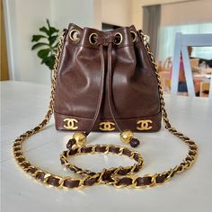 Vintage Chanel Mini Triple Cc Bucket Bag In Gorgeous Brown Caviar Leather With Shiny 24k Gold Plated Hardware. Ultra Rare Item In Very Good Condition With Some Minimal Signs Of Wear Consistent With Age. Some Tarnishing To The Hardware But Overall Very Good Shiny Condition. Leather Is In Very Good Condition With Some Minimal Signs Of Wear, No Odors, Scratches, Holes, Or Pilling. Clean Interior. Comes With Its Insert. Serial Sticker Illegible. 100% Authentic. 8” H X 8” W X 3” D Can Be Worn Crossbody Easily Chanel Mini Bag Vintage, Chanel Mini, Vintage Chanel, Bucket Bag, 3 D, Bag Lady, Chanel, Leather, How To Wear