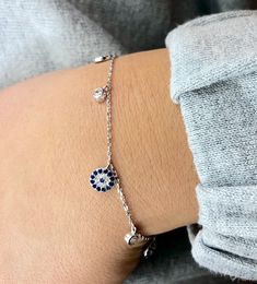 "Beautiful Sterling Silver evil eye bracelet with cross! looks great with other pieces. perfect for everyday wear and as a gift. * bracelet is 7.5 + 1\" extender * evil eye charm is 7 mm  * cubic Zirconia is 3mm -------- Evil Eye The evil eye, known as \"mati\" (μάτι) in Greek culture, is a curse thought to be given by a malicious glare that can cause bad luck or loss. People can knowingly wish negative thoughts on you, but the power of the eye is that some people unknowingly and innocently cast Silver Girly Jewelry, Evil Eye Jewelry Bracelet, Evil Eye Bracelet Silver, Silver Evil Eye Bracelet, Silver Friendship Bracelets, Bracelet With Cross, Greek Culture, Bracelet Diamond, Gift Bracelet