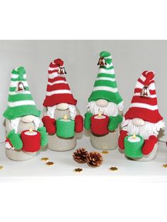 crocheted christmas gnomes with cups and pine cones