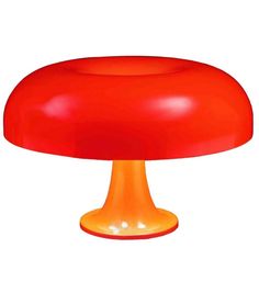 an image of a red mushroom lamp on white background