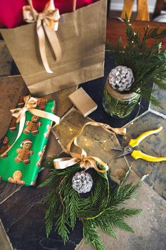 christmas presents are wrapped in green paper and tied with gold ribbon, sitting on a table