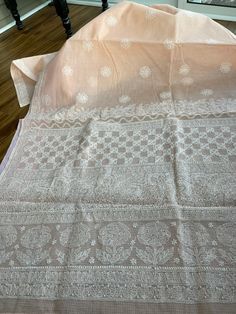 Type - chikankari Condition - brand new Material - pure kota cotton (soft)  Color - peachy pink Blouse piece included  Fall and picot done  hand embroidery work  Entire saree is hand embroidered, very meticulously and painstakingly done. The finishing of this saree is extremely good. Cotton Saree With Chikankari Embroidery, Unstitched Cotton Saree With Chikankari Embroidery, Peach Chanderi Saree With Resham Embroidery, Cotton Chikankari Embroidered Saree, Chikankari Embroidery Cotton Saree, White Cotton Saree With Chikankari Embroidery, Unstitched Peach Saree With Resham Embroidery, Peach Chanderi Dupatta With Cutdana, Peach Dupatta With Cutdana