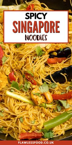 spicy singapore noodles with shrimp and vegetables in a skillet