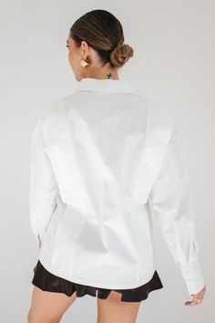 STYLE + FIT NOTES: Get ready to look chic + sleek in our Henrietta Structured Blouse! With its fitted silhouette, this blouse flatters your figure + can be dressed up or down. Perfect for pairing with your favorite skirt, this blouse runs true to size + will become a staple in your wardrobe. Elegant Button-up Ruffled Tops, Elegant Ruffled Button-up Tops, Elegant Button-up Tops With Ruffles, Fitted Ruffle Shirt Elegant Style, Chic Long Sleeve Workwear Tops, Fitted Ruffle Blouse For Office, Fitted Long Sleeve Top With Structured Shoulders, Elegant Ruffled Blouse For Work, Chic Long Sleeve Tops For Work