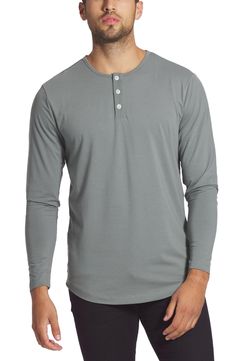 A curved hem and smooth cotton blend further the casual versatility of a long-sleeve henley that's easy to layer or wear alone. Crewneck Button half-placket Long sleeves 62% polyester, 33% cotton, 5% spandex Machine wash, dry flat Imported Everyday Long Sleeve Henley With Button Closure, Casual Long Sleeve Henley With Button Closure, Henley Loungewear For Fall, Long Sleeve Henley For Everyday Fall Wear, Everyday Long Sleeve Henley For Fall, Everyday Fall Long Sleeve Henley, Relaxed Fit Henley For Layering, Spring Long Sleeve Henley For Loungewear, Relaxed Fit Crew Neck Henley For Layering