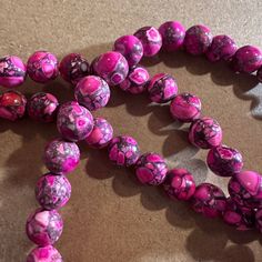 Color: pink black and white Style: round Size: 8 mm Hole size: 1mm Number of beads: about 50 Limited quantities Pink Round Beaded Jewelry 8mm, Pink Beaded Jewelry With 8mm Round Beads, Pink Round 8mm Bead Jewelry, Pink Round Spiritual Beaded Bracelets, Pink Spiritual Beaded Bracelet With Polished Beads, Spiritual Pink Beaded Bracelets With Polished Beads, Pink 8mm Beads Spiritual Beaded Bracelet, Pink Spiritual Style Beaded Bracelets With 8mm Beads, Pink Spiritual Beaded Bracelet With 8mm Beads