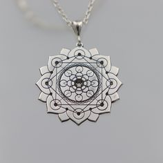 ★Item Details * Gender: Male / Female * Material:  925 Sterling Silver * Finish: Polished  * Chain : 925 Sterling Silver * Shipping: 2-5 days  * Handmade * Personalization: YES This unique silver necklace features a detailed design with three layers of 8 circles each, framed within an elegant lotus flower. Each petal of the lotus contains a circle, with an additional 8 circles in the center, and 8 more at the core. This intricate and meaningful design symbolizes harmony, balance, and spiritual a Silver Etched Necklace With Flower Pendant, Spiritual Medallion Jewelry With Si Clarity, Etched Sterling Silver Necklaces, Sterling Silver Etched Jewelry As Gift, Sterling Silver Etched Jewelry For Gifts, Silver Etched Sterling Silver Necklace, Etched Sterling Silver Jewelry As Gift, Symbolic Sterling Silver Necklace For Meditation, Sterling Silver Symbolic Necklace For Meditation