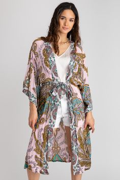 Our Regal Medallion Printed Midi Duster showcases stunning large paisleys and regal medallion patterns, interwoven with botanical and floral motifs. Designed to flatter, its midi length enhances the legs while providing an elegant drape, thanks to its lightweight, breathable fabric. Complete with a fabric belt closure, it offers versatility as a chic beach or resort cover-up.


Materials: 100% Rayon Spring Paisley Print Open Front Kimono, Spring Bohemian Paisley Print Kimono, Spring Open Front Paisley Print Kimono, Bohemian Long Kimono With Paisley Print, Long Bohemian Kimono With Paisley Print, Bohemian Multicolor Floral Print Kimono, Long Paisley Print Kimono For Beach, Long Kimono With Paisley Print For Beach, Spring Kimono With Paisley Print And Kimono Sleeves