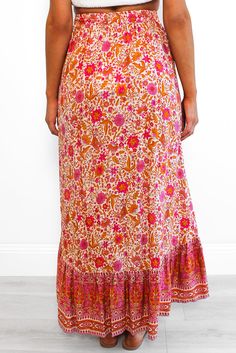 Red Floral Motif Talking Pretty Maxi Skirt Pink Floral Print Maxi Bottoms, Festival Floral Print Tiered Skirt, Floral Print Tiered Skirt For Festival, Festival Floral Print Tiered Skirt Bottoms, Red Long Wrap Skirt For The Beach, Red Maxi Length Bottoms For Spring, Festival Pink Floral Print Bottoms, Pink Floral Print Festival Bottoms, Pink Floral Print Bottoms For Festival