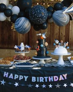 a black and white birthday party with balloons