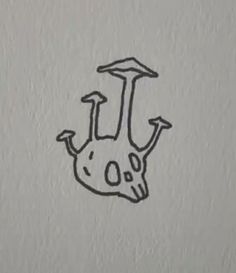 a drawing of a skull with an arrow on it's head and two arrows pointing up