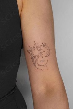 a woman with a sun tattoo on her arm