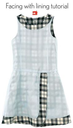 a white dress with black and white checks on it, in front of the words facing with