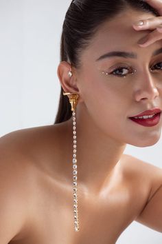 22k gold plated, 925 silver base ear cuffs handcrafted with carved work horse detailed top and white Swarovski stone embellished long tassel. - Aza Fashions Luxury Ear Cuff For Pierced Ears For Formal Occasions, Luxury Pierced Ear Cuff For Formal Occasions, Luxury Pierced Ear Cuff For Formal Events, Luxury Formal Pierced Ear Cuff, Luxury Wedding Ear Cuff For Pierced Ears, White Gold Clip-on Jewelry For Party, Fine Jewelry Single Earring For Party, Luxury Cubic Zirconia Ear Cuff For Formal Occasions, Single Yellow Gold Earring For Party