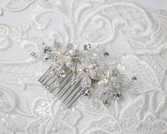 A simply classic wedding hair comb style with ivory freshwater cultured pearls and crystal beads in the center of three crystal-covered flowers. This bridal comb measures about 3.5 inches long and 2 inches high. Pearls Hair, Classic Wedding Hair, Pearl Hair Combs, Crystal Flowers