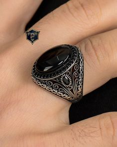 "Byzantine Chain Design Ring, Turkish Silver Ring, Men's Black Onyx Silver Ring, Handmade Gemstone Ring, 925 Sterling Silver, Gift for Men ✦ Details ✦ * Material: 925 Sterling Silver * Gemstone: Onyx * Weight: 12.00 grams * The size of the stone: 15x20 mm. * Sides oxidized, decorated with Garnet stones and Micro Zircon stones. * Stamp: 925 * Available sizes; 5 US to 16 US. Contact me if you need any other size! ✦ Shipping ✦ * Processing time: 1-3 business days. * This item ships from my Turkish workshop in Istanbul. * Add your phone number in address box for a smoother delivery. That makes courier personnel's job easier.  ✦ Packaging ✦ * Comes with a luxury gift box and a jewellery cleaning cloth and courtesy gift. ✦ Returns, Exchanges ✦ * Return option available for 30 days after the deli Silver Gemstone Rings For Men, Handmade Onyx Jewelry, Ornate Black Rings As Gift, Ornate Black Rings For Gifts, Ornate Black Rings For Gift, Ornate Black Sterling Silver Rings, Ornate Black Oval Ring, Onyx Silver Ring, Turkish Rings