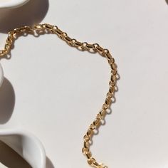 Picture a sleek and elegant gold bracelet, designed with minimalism in mind. It features a delicate chain crafted from shimmering 14k gold fill, offering a subtle yet luxurious glow. This piece embodies sophistication and refinement, perfect for adding a touch of timeless elegance to any ensemble. DETAILS14k gold fill Hypoallergenic, water proof, and nickel free To determine your wrist size, use a tape measure or ribbon around your wrist, then measure against a ruler. 14k Gold Bracelet With Cable Chain, Classic Gold Bracelet With Cable Chain, Minimalist Gold-tone Bracelets For Formal Occasions, Elegant Everyday Bracelets With Rolo Chain, Minimalist Gold Link Bracelet For Everyday, Minimalist Link Gold Bracelet For Everyday Luxury, Dainty Bracelet With Cable Chain And Oval Link, Minimalist Gold Bracelet With Oval Link Chain, Dainty Cable Chain Bracelet With Oval Links