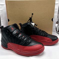 The "Flu Game" Air Jordan 12 is an iconic sneaker released by Nike's Jordan Brand. It gained its nickname due to its association with one of Michael Jordan's most legendary performances in the 1997 NBA Finals, where he played through illness (thought to be flu-like symptoms) and led the Chicago Bulls to victory against the Utah Jazz. Colorway: The Flu Game Jordan 12 features a primarily black upper with varsity red accents. The red is prominently displayed on the heel tab, Jumpman logo, and the Air Jordan 12, Jumpman Logo, Game & Watch, Jordan 12 Retro, Jordan 12, Jordans 12, Sneaker Release, Utah Jazz, Nba Finals