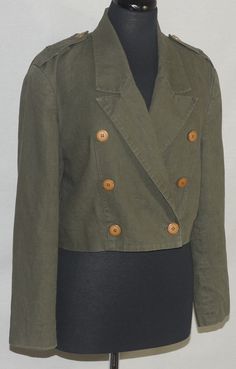 "This vintage khaki green short waist double breasted jacket is a fabulous '81st and Park' label original. This linen and cotton blend coat has a military trench style cut to it and full lining. It has nice big accent buttons and shoulder epaulets. The tailoring of this jacket is really great! You will love this forever classic that's so on trend. The label says it's a size M and flat measurements are here for you to check the fit. It is also in really great vintage condition. Check out the phot Luxury Vintage Single Breasted Utility Jacket, Vintage Cropped Outerwear For Work, Vintage Cropped Outerwear For Spring, Vintage Khaki Spring Blazer, Fitted Vintage Khaki Blazer, Vintage Cropped Fitted Outerwear, Spring Military Style Fitted Tops, Fitted Military Tops For Spring, 1980s Women