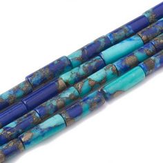 three pieces of blue and brown glass beads