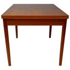 a small wooden table with two legs and a square top on an isolated white background