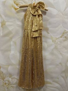 Gorgeous gold sequins jumpsuit, romper with bow.  Zipper back.   Fabric: sequins. Ready to ship in size 5-6 (measurements on the photos). Gold Party Jumpsuit With Sequins, Gold Sequined Jumpsuits And Rompers For Party, Gold Sequin Jumpsuits And Rompers For Night Out, Party Season Sequined Jumpsuits And Rompers, Gold Jumpsuit And Romper For Summer Party, Sequin Jumpsuits And Rompers For Party, Gold Jumpsuits And Rompers For Summer Party, Gold Jumpsuits And Rompers For Evening Party Season, Glamorous Gold Jumpsuits And Rompers For Party Season